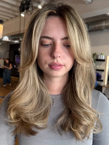 Oval Layered Haircut Medium with Blonde Highlights