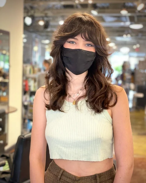 Layered Brunette Cut with Wispy Bangs