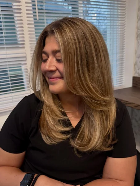 Oval Layered Haircut Medium with Honey Highlights