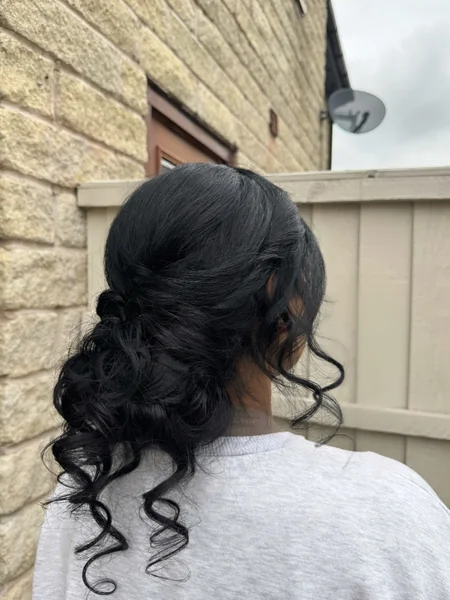 Low Side Bun with Curls for Reception