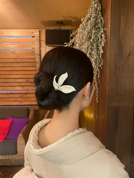 Traditional Japanese Bun Hairstyle with Flower Hairpin