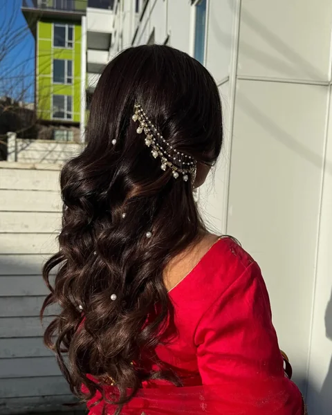 Half-Up Curls with Pearl Pins for Reception Saree