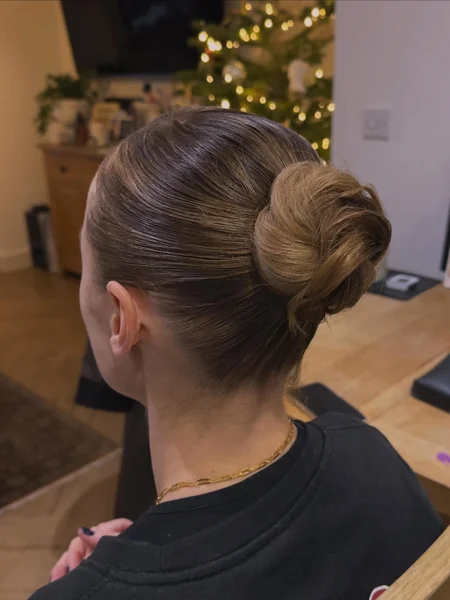 Slicked-Back Bun with Gold Accents