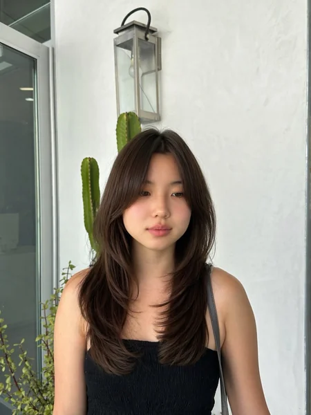 Oval Face Layered Haircut with Soft Waves