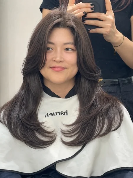 Center-Part Long Layered Hairstyle