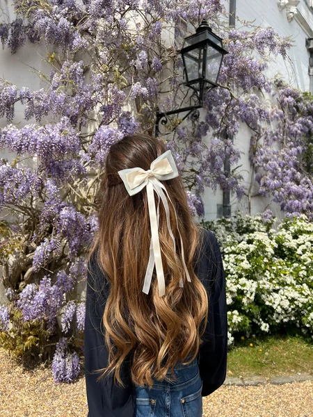 Half-Up Hairstyle with Cream Ribbon Bow