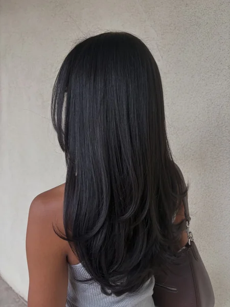 Sleek Long U-Shaped Haircut in Black Hair