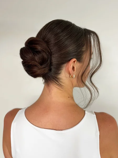 Low Bun Slickback with Money Piece