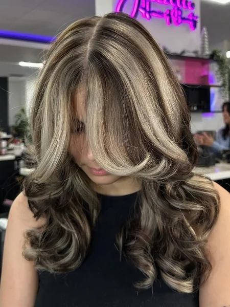 Chunky Blonde Streaks with Bouncy Curls