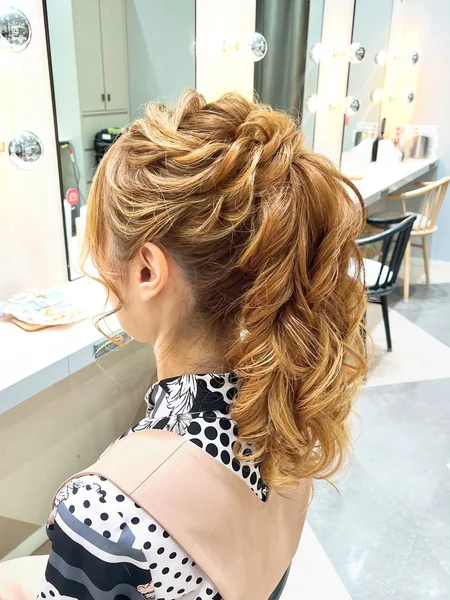 Twisted High Wavy Ponytail Updo