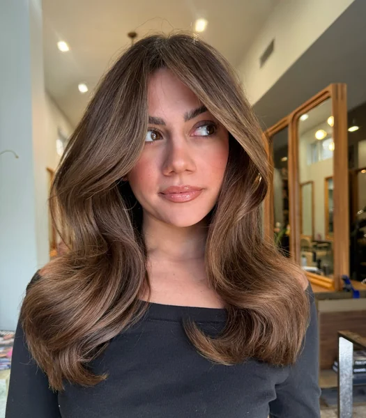 Voluminous Brunette Layers with Bangs
