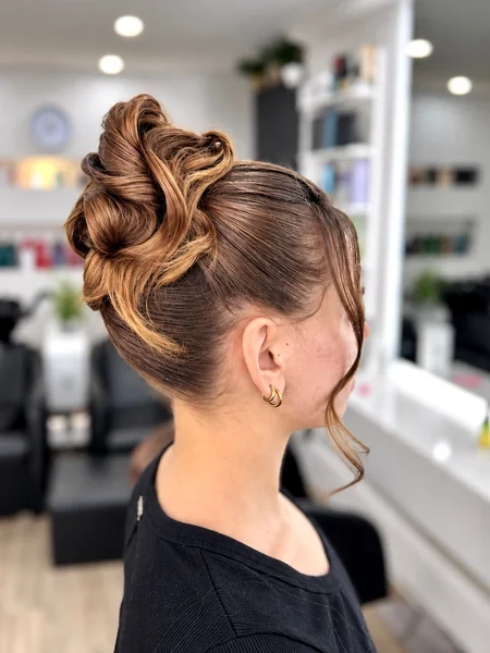 Sleek High Sculpted Curl Updo