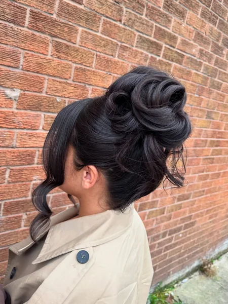 Voluminous Curled High Bun