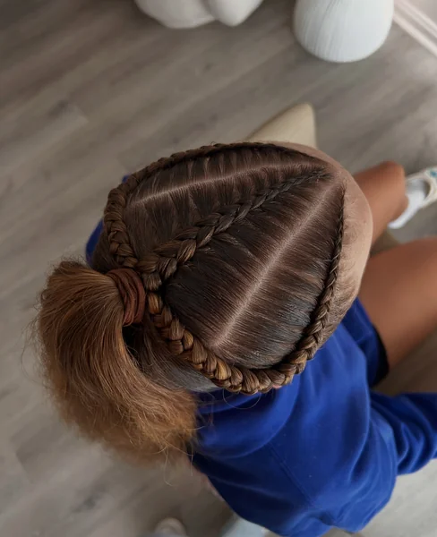 Braided Pigtails Under a Cap