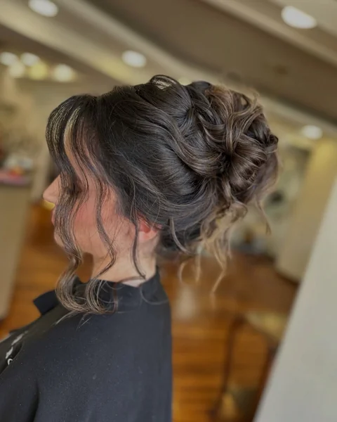 Messy Curly Updo with Curtain Bangs