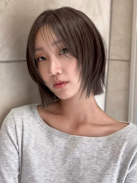 Sleek Layered Bob With Wispy Bangs