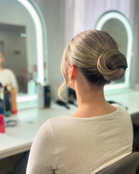 Sleek Low Chignon with Face Strand