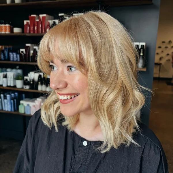 Blonde Wavy Lob with Full Bangs