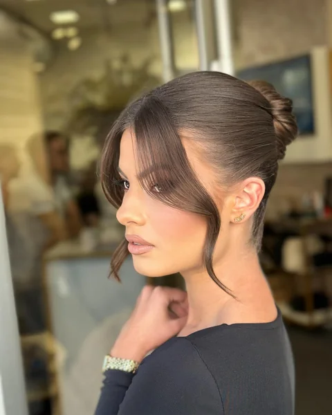 High Bun with Curtain Bangs