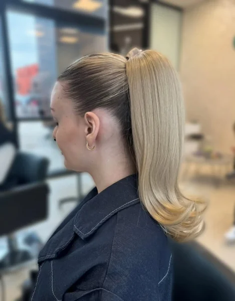 Sleek High Ponytail with Flipped Ends