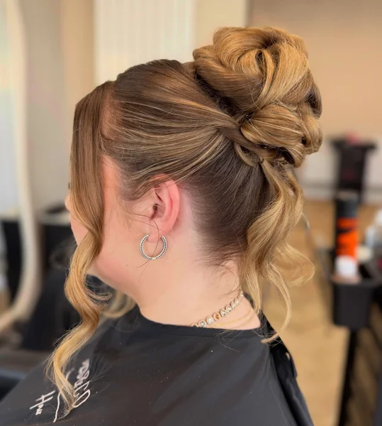 Sculpted High Bun with Tendrils