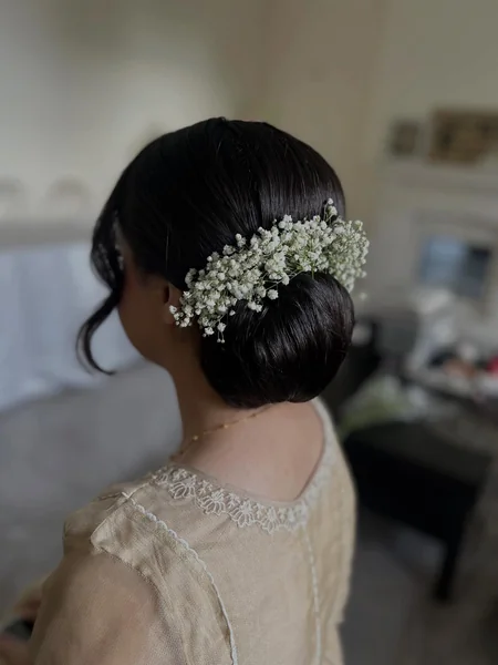 Sleek Low Bun with Baby's Breath