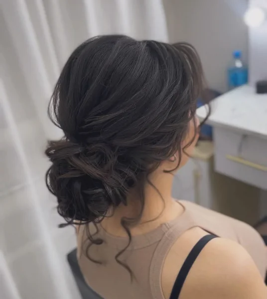 Loose Low Chignon With Tendrils