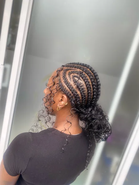 Curved Cornrows into Curly Ponytail