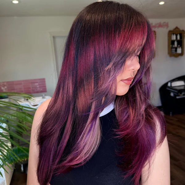 Magenta Layered Hair with Curtain Bangs