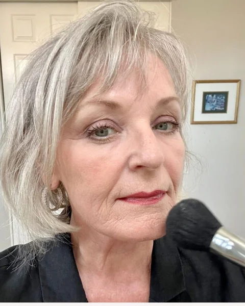 2. Silver Shaggy Bob with Wispy Bangs
