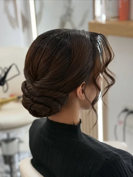 Low Chignon with Face-Framing Tendrils
