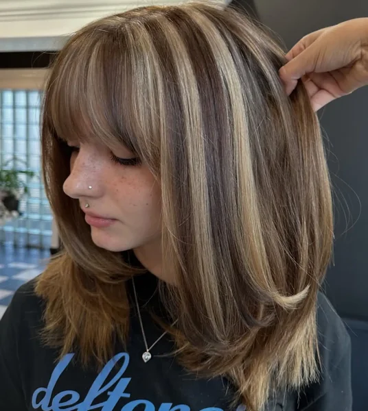 Blunt Bangs with Bold Blonde Stripes