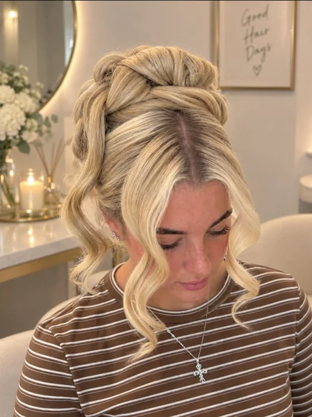 High Twisted Updo with Face-Framing Curls