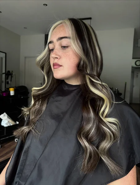 Bold Chunky Blonde Streaks on Brunette