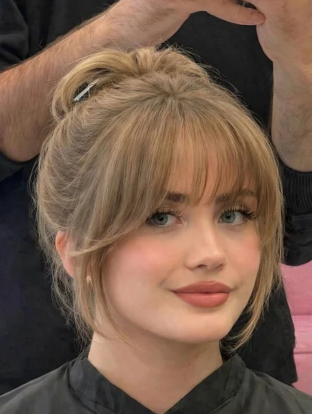 Messy Bun with Wispy Bangs