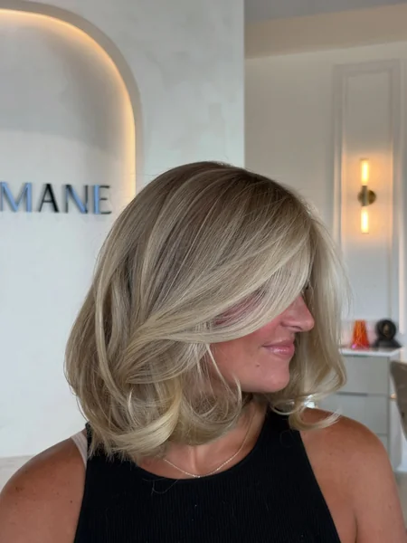 Voluminous Blonde Bob with Flicked Ends