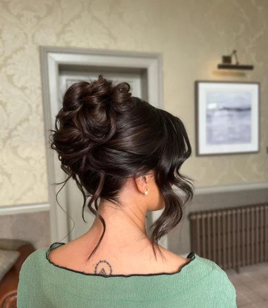 Textured Brunette Updo with Loose Tendrils