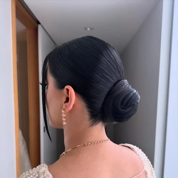 Glossy Black Low Bun for Brides