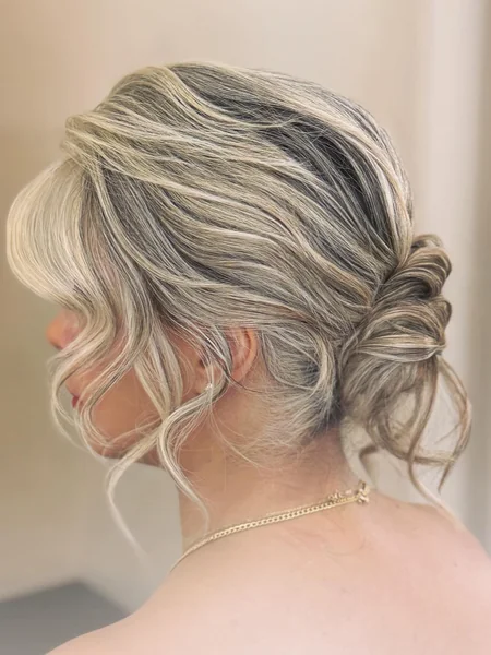 Soft Wavy Low Bun With Face Framing