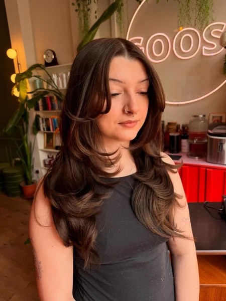 Long Brunette Layers with Curtain Bangs