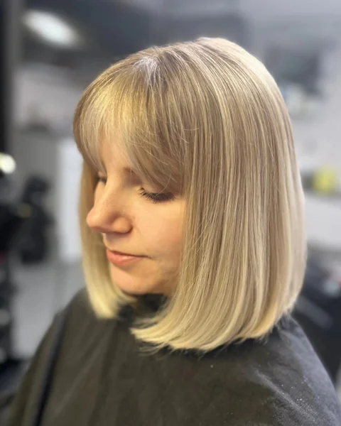Shoulder-Length Bob with Full Bangs