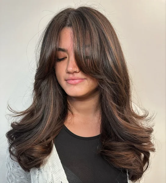 Layered Brunette Waves with Bangs