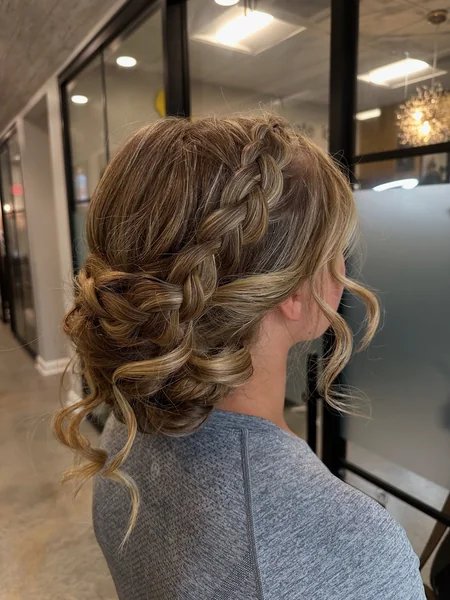 Curly Low Bun with Dutch Braid