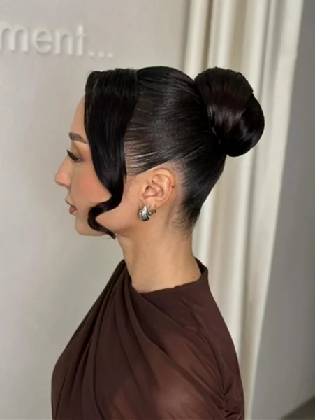 Sculpted High Bun with Face Curl