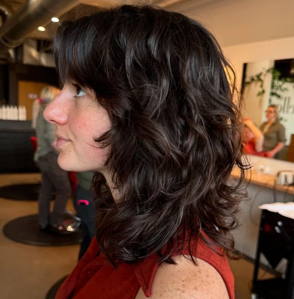 Curly Brunette Shag with Bangs
