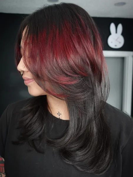 Black Hair with Red Face-Framing Streaks