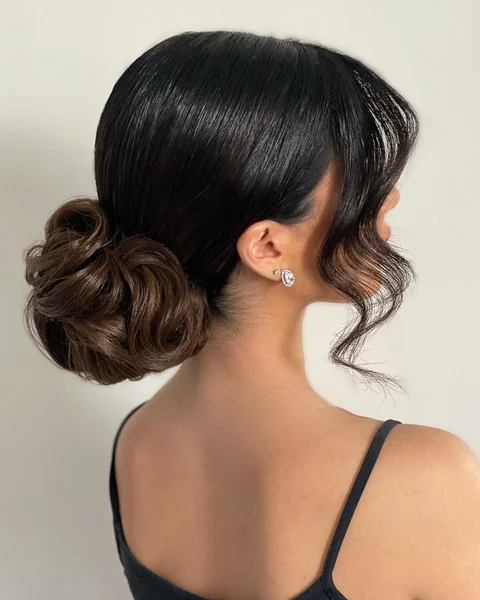 Low Chignon with Face-Framing Pieces