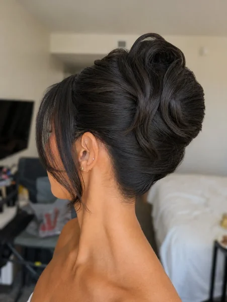 Sleek High Chignon with Fringe