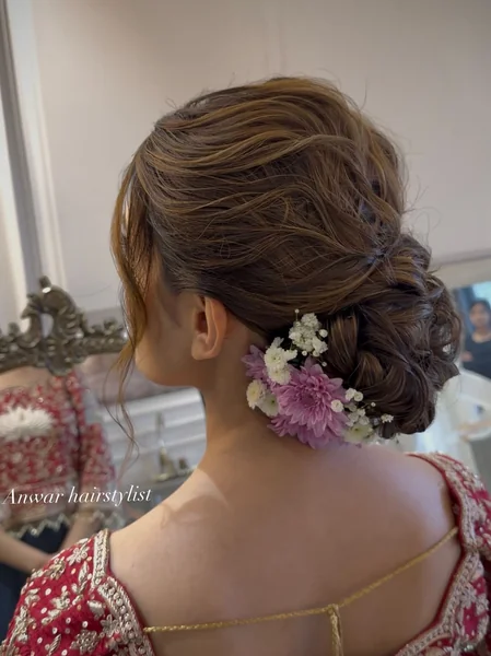Messy Bun With Pink Flowers