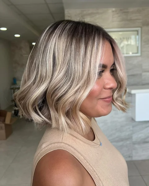 Wavy Balayage Bob With Dark Roots